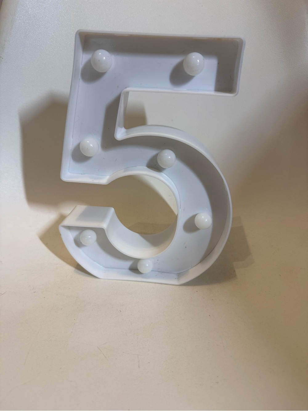 White Number 5 marquee light
